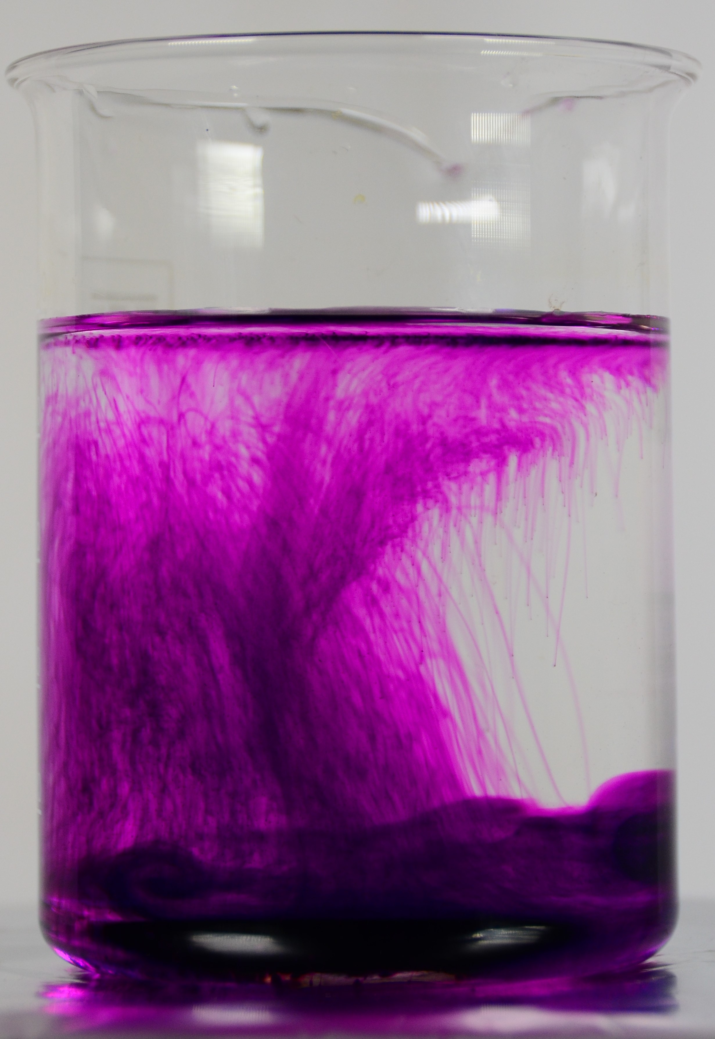 A beaker of water and potassium permanganate